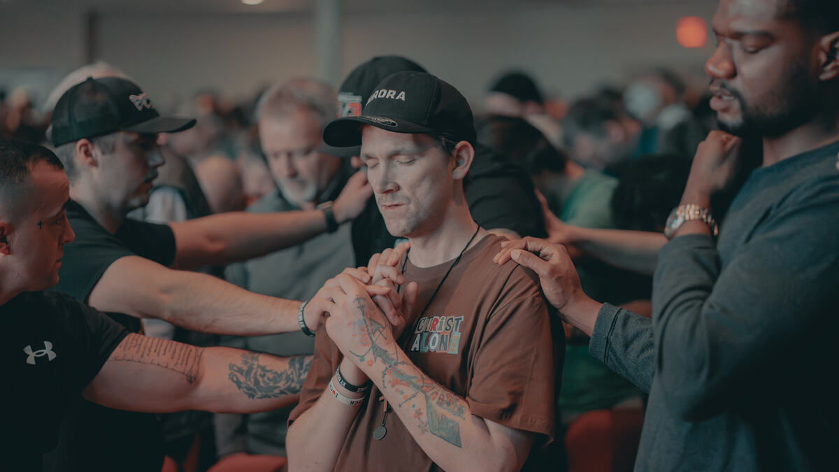 Men praying together