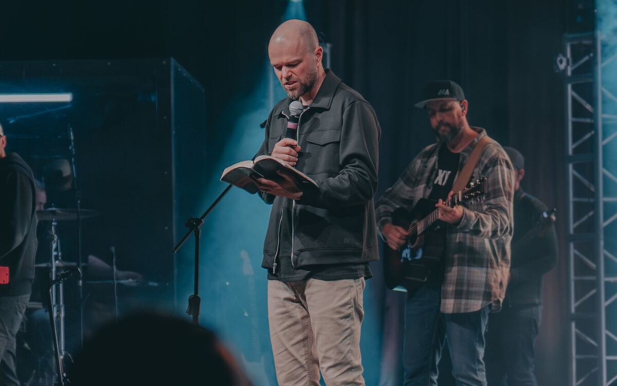 Pastor preaching with an open Bible